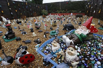 Gnomes and other garden ornaments fill the back garden of Nigel and Jean Balcombe in Ashford, southeast England February 10, 2013.